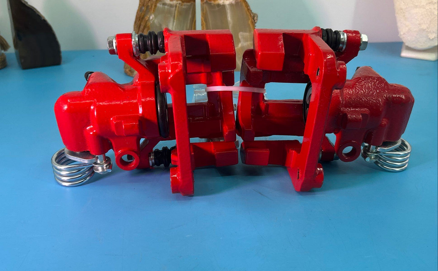 Pair of Dual-Piston Red Brake Calipers with Parking Brake Lever