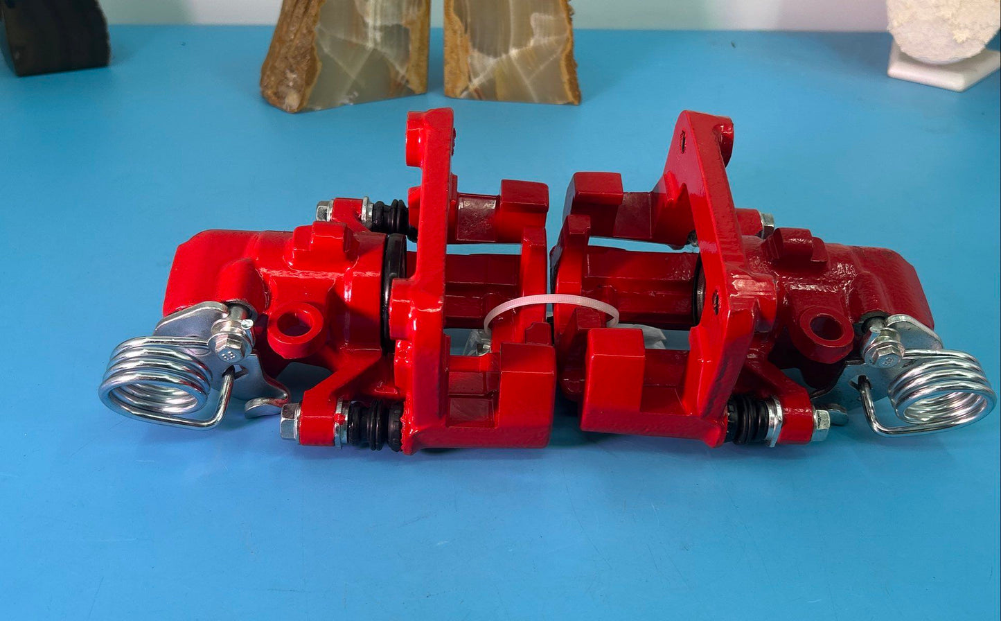 Pair of Dual-Piston Red Brake Calipers with Parking Brake Lever
